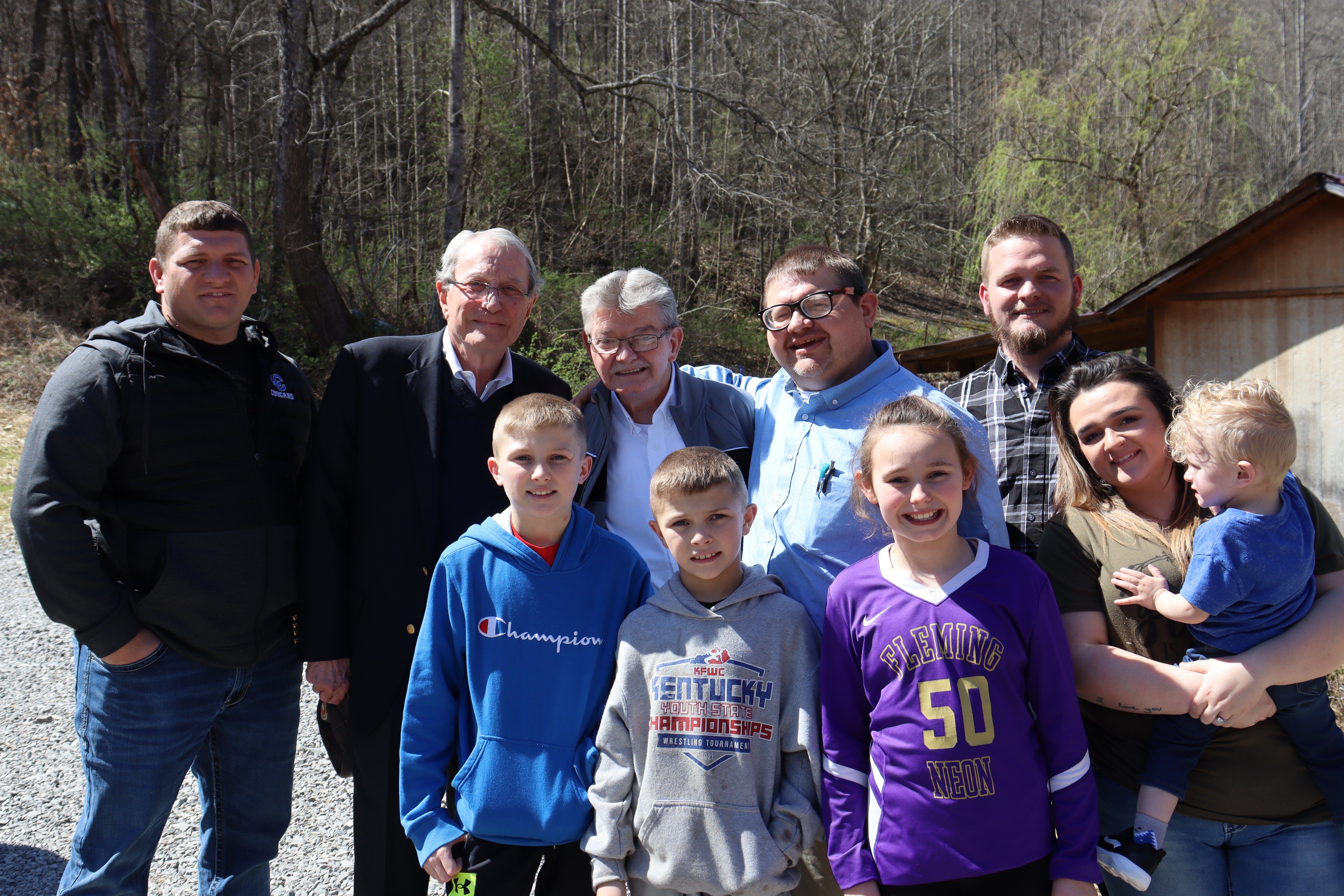 Winston Miller poses with William, Jason, and their family