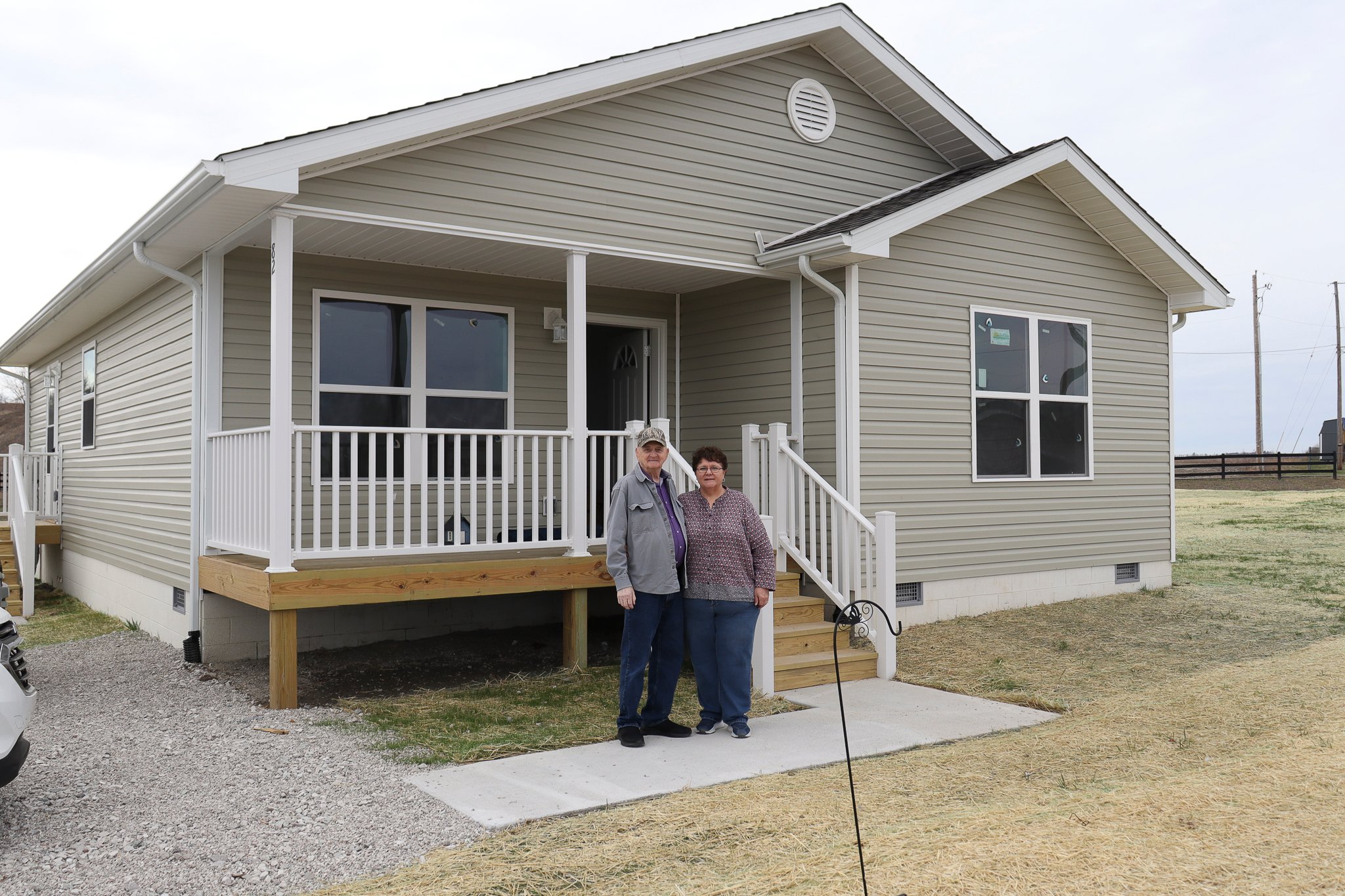 George and Sherry Mullins outside their new home in Chavies
