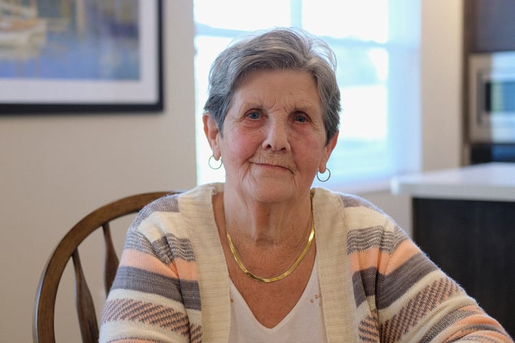 Ingrid Holt in the community room at the Residences at Courtyard Crossing